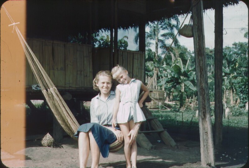 Color slide of Elisabeth and Valerie Elliot sitting on hammock in Shandia, August 1962. Elisabeth and Valerie left the Waorani settlement in Tewæno in December 1961, but lived in Ecuador for two more years working with the Quichua people near Shandia.