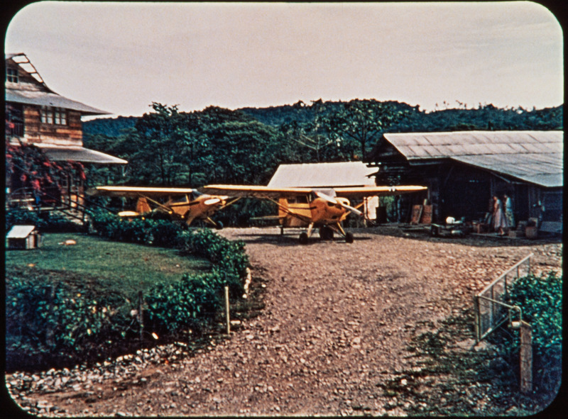 Two planes, main house, and hanger at Shell Mera, Nate Saint's home and the MAF base in Ecuador. Frame from <i>Mid-Century Martyrs</i> filmstrip developed by HCJB, Mission Aviation Fellowship, and the five widows in 1956.