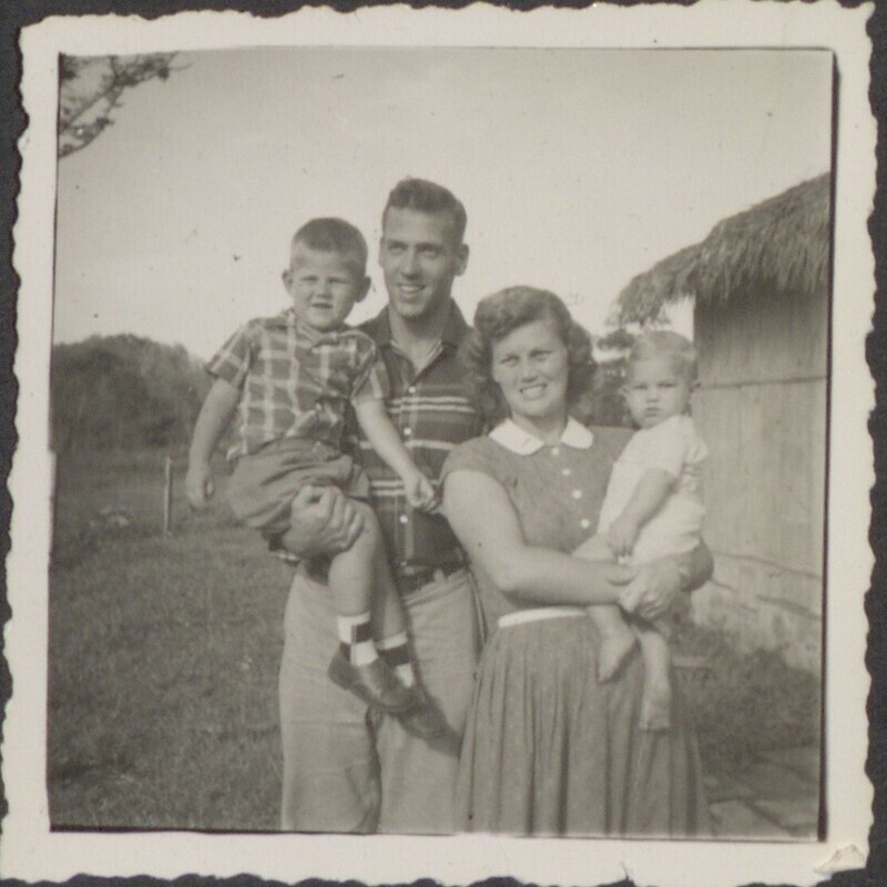 Black and white photograph of Ed and Marilou McCully with their two oldest children, Steve and Mike McCully, c. 1955. 
