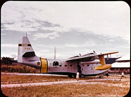 Air-Sea Rescue Flying Boat (SA-16) lands at Shell Mera to bring men and equipment to assist in the search for the five men. One frame from filmstrip titled "Unforgettable Friday," which tells the story of Nate Saint and his family, missionary work with Mission Aviation Fellowship and involvement in Operation Auca. Filmstrip was developed by Marj Saint and MAF in late 1956.