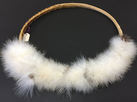 Headdress with white feathers (also called a crown). Part of a small collection of Waorani artifacts that Rachel Saint gave to the Billy Graham Center Museum in 1984, which were transferred to Wheaton Archives & Special Collections in 2015.