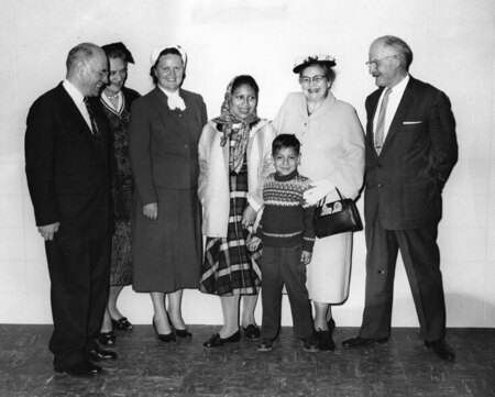 Photo of Dayuma with son, Ignacio (center), flanked (left) by Dr. V. Raymond Edman, Lois McCully (Ed McCully's mother), and Rachel Saint, and (right) Clara and Fred Elliot (parents of Jim Elliot). During Rachel’s speaking tour around the U.S. with Dayuma, they visited with Dr. V. Raymond Edman and the parents of Jim Elliot and Ed McCully at Wheaton College in Wheaton, Illinois.